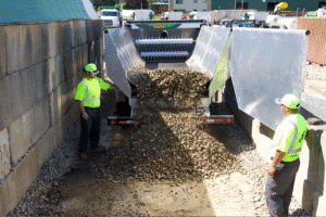 Efficient material unloading process at a construction site.